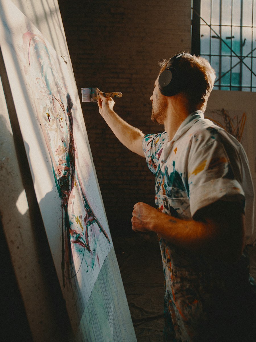 Artist painting a large canvas