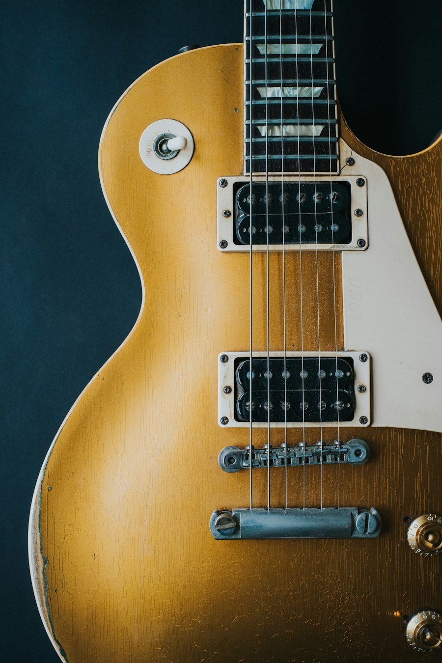 Gold-top electric guitar with humbucker pickups