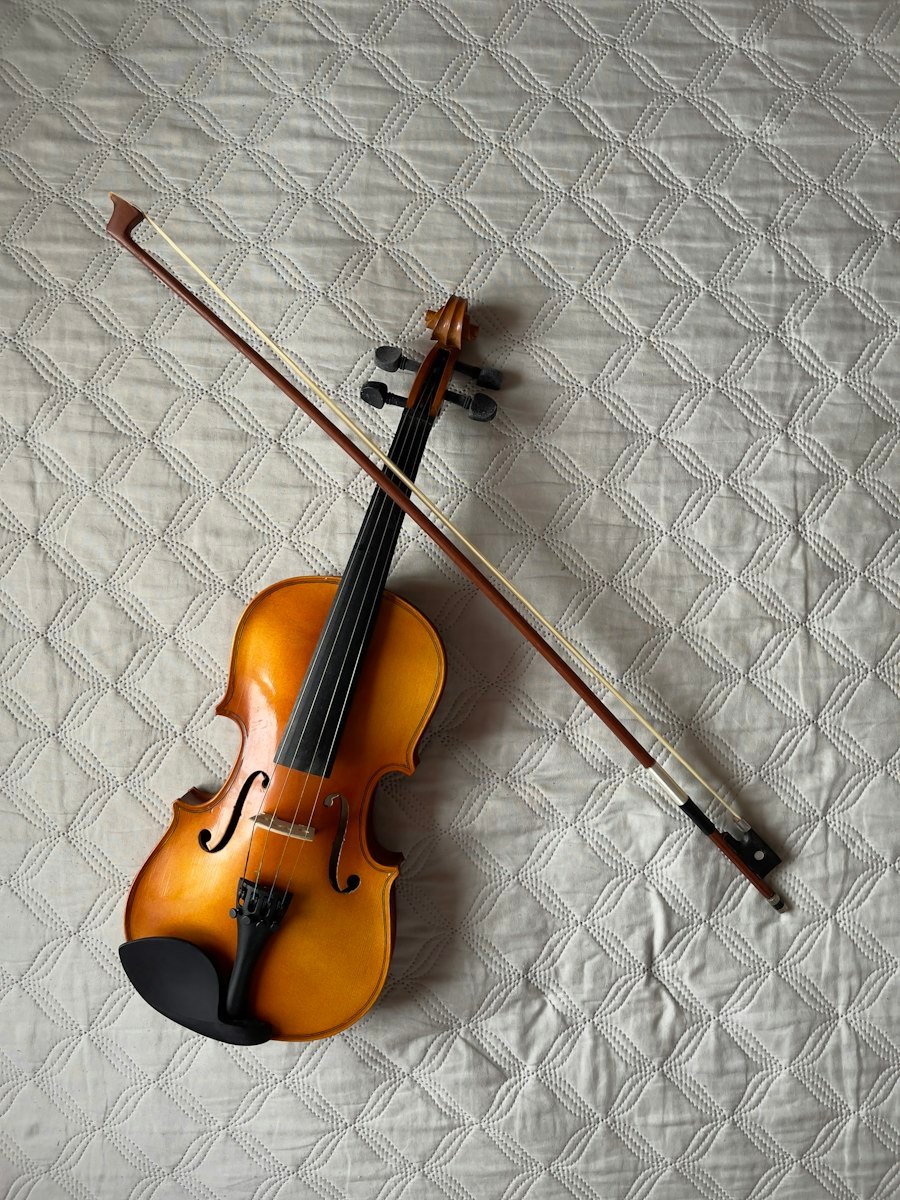 Violin and bow on a quilted cloth
